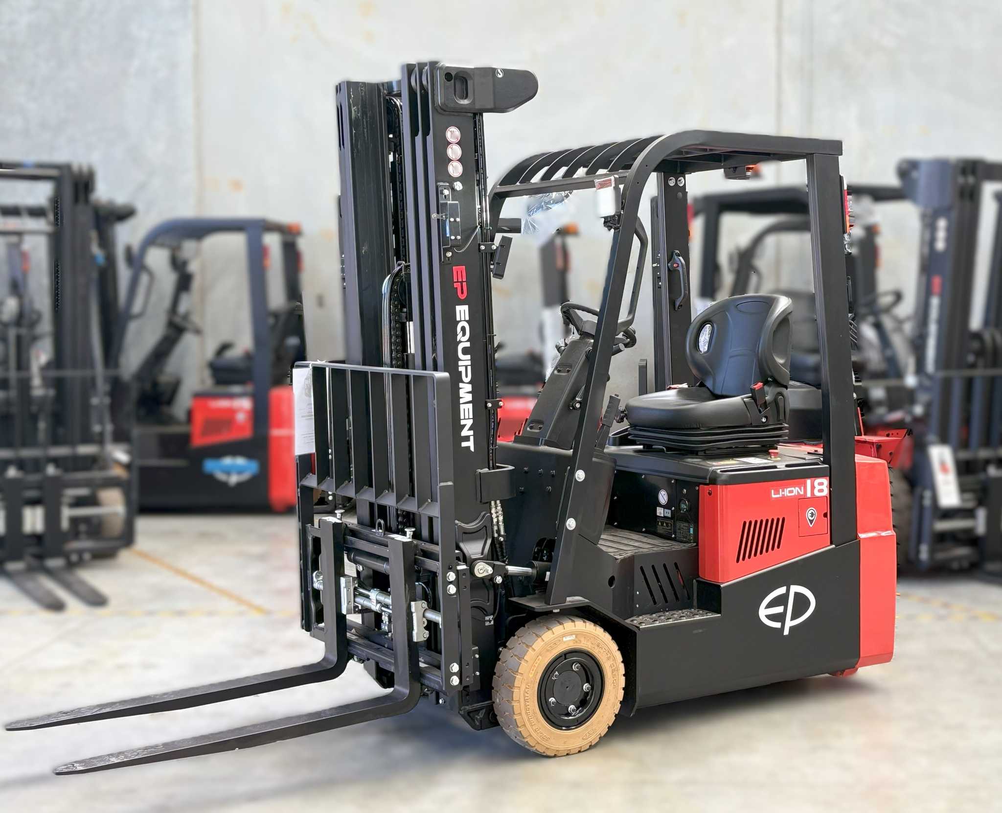 Thumbnail of On site photo of CPD18TVL 1.8T three-wheel lithium-ion electric forklift by EP Equipment stopping in warehouse