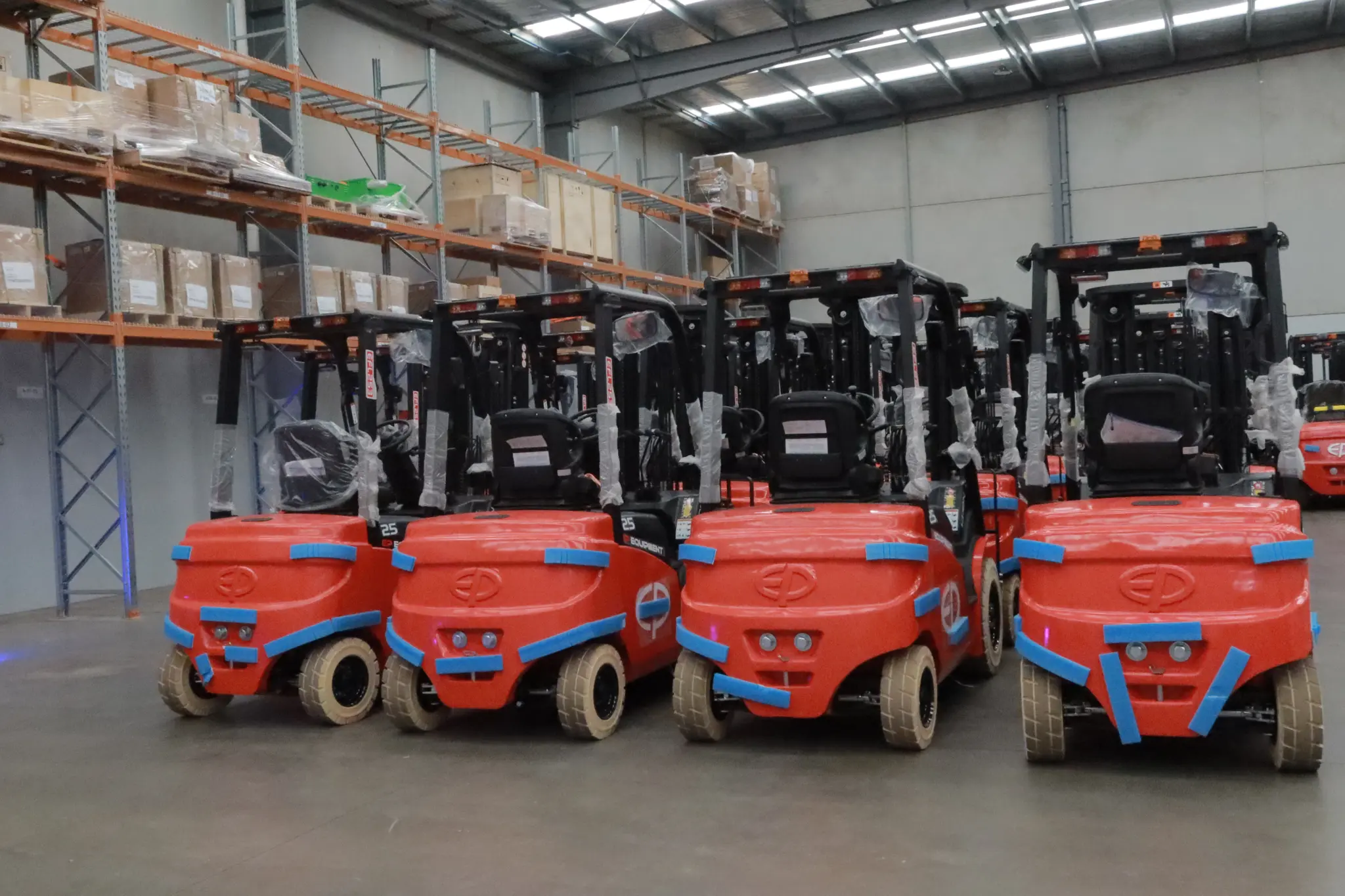EPower electric forklifts lined up in warehouse ready for efficient logistics operations