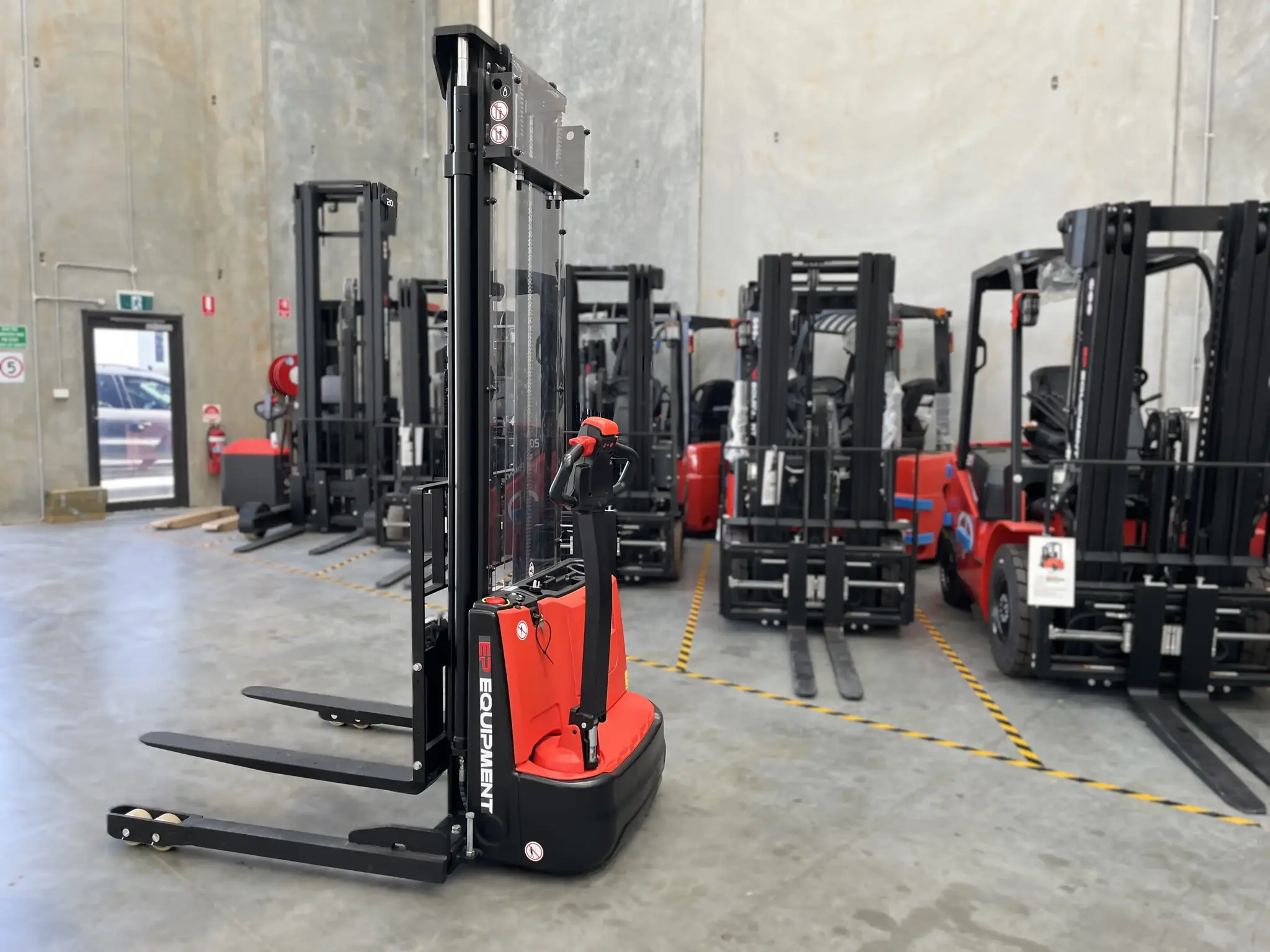 EPower electric pallet stacker handling pallet lifting in compact warehouse operations