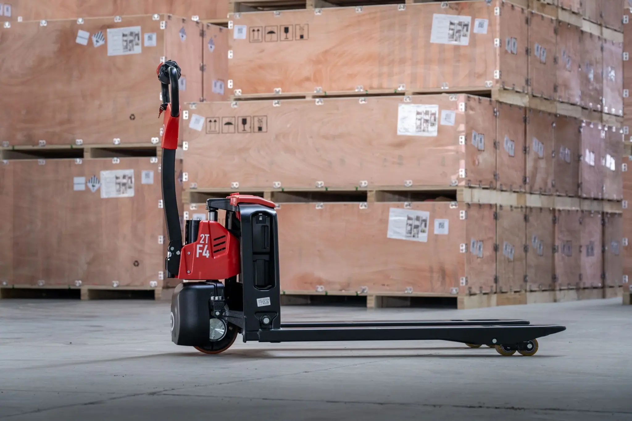 Side view of EP Equipment F4-201 electric pallet truck in warehouse environment.