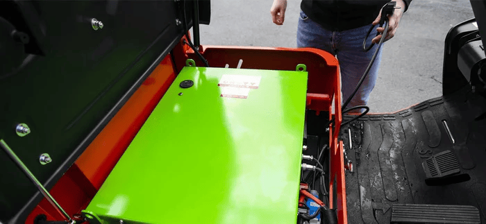 Open compartment showing lithium-ion battery installed in electric forklift for low-maintenance, high-efficiency operation