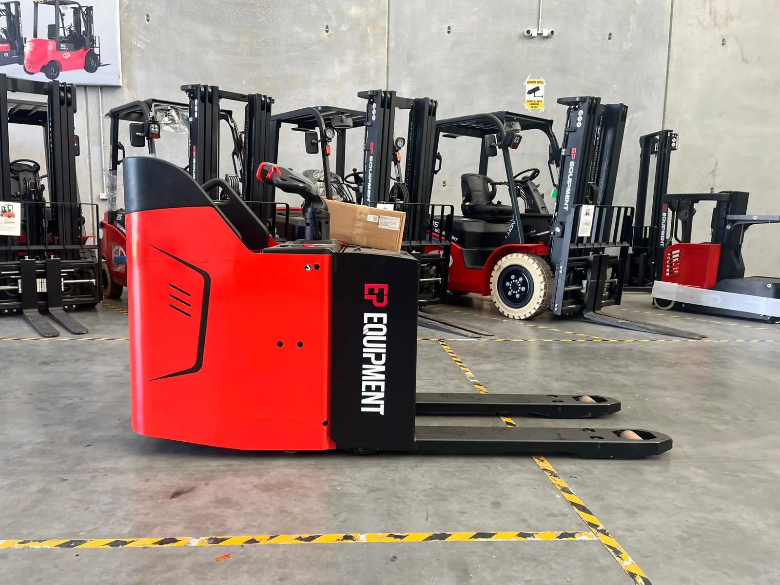 EPower electric pallet truck transporting goods across warehouse floors for efficient material handling