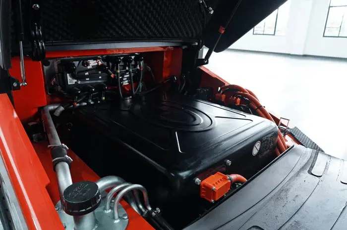 Open compartment showing lithium-ion battery installed in electric forklift for low-maintenance, high-efficiency operation