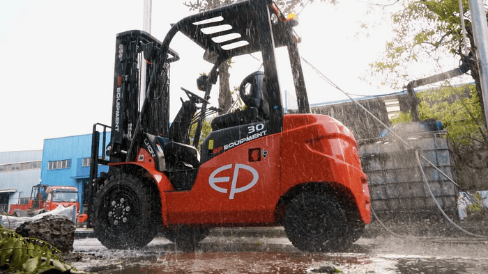 lithium forklift by EP Equipment operating in heavy rain, demonstrating all-weather durability with overhead guard protection
