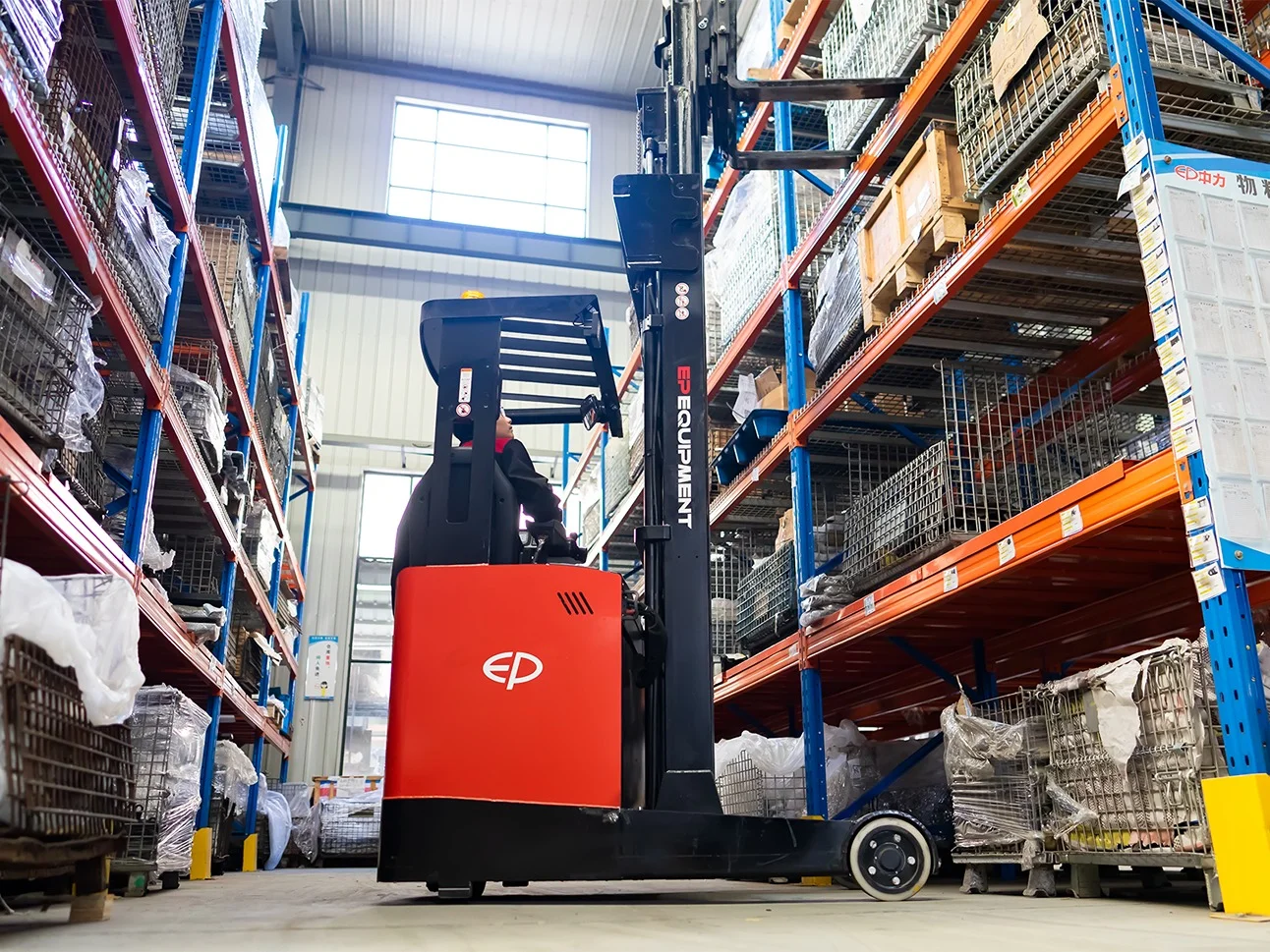 EP Equipment CQD20L electric reach truck operating in a warehouse, lifting goods to high storage racks with precision and stability.
