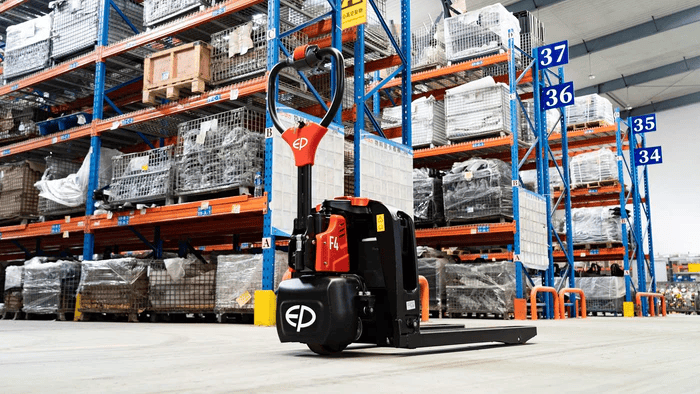 EP Equipment F4 compact electric pallet truck parked in warehouse environment.