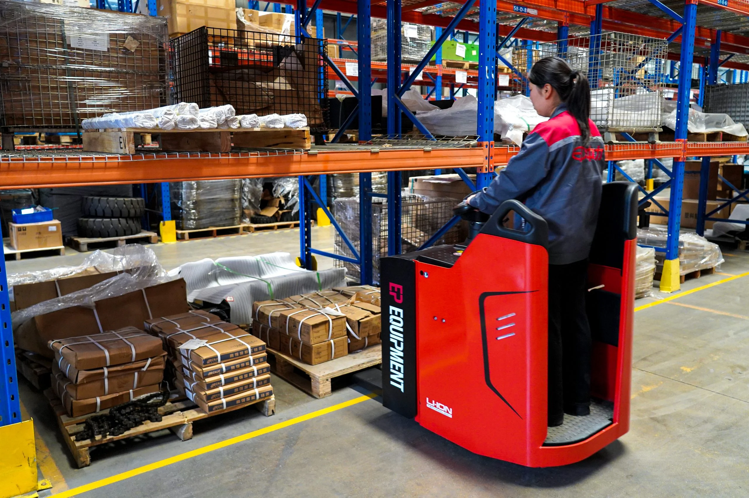 EP Equipment KPL201 ride-on electric pallet truck in operation for pallet handling.