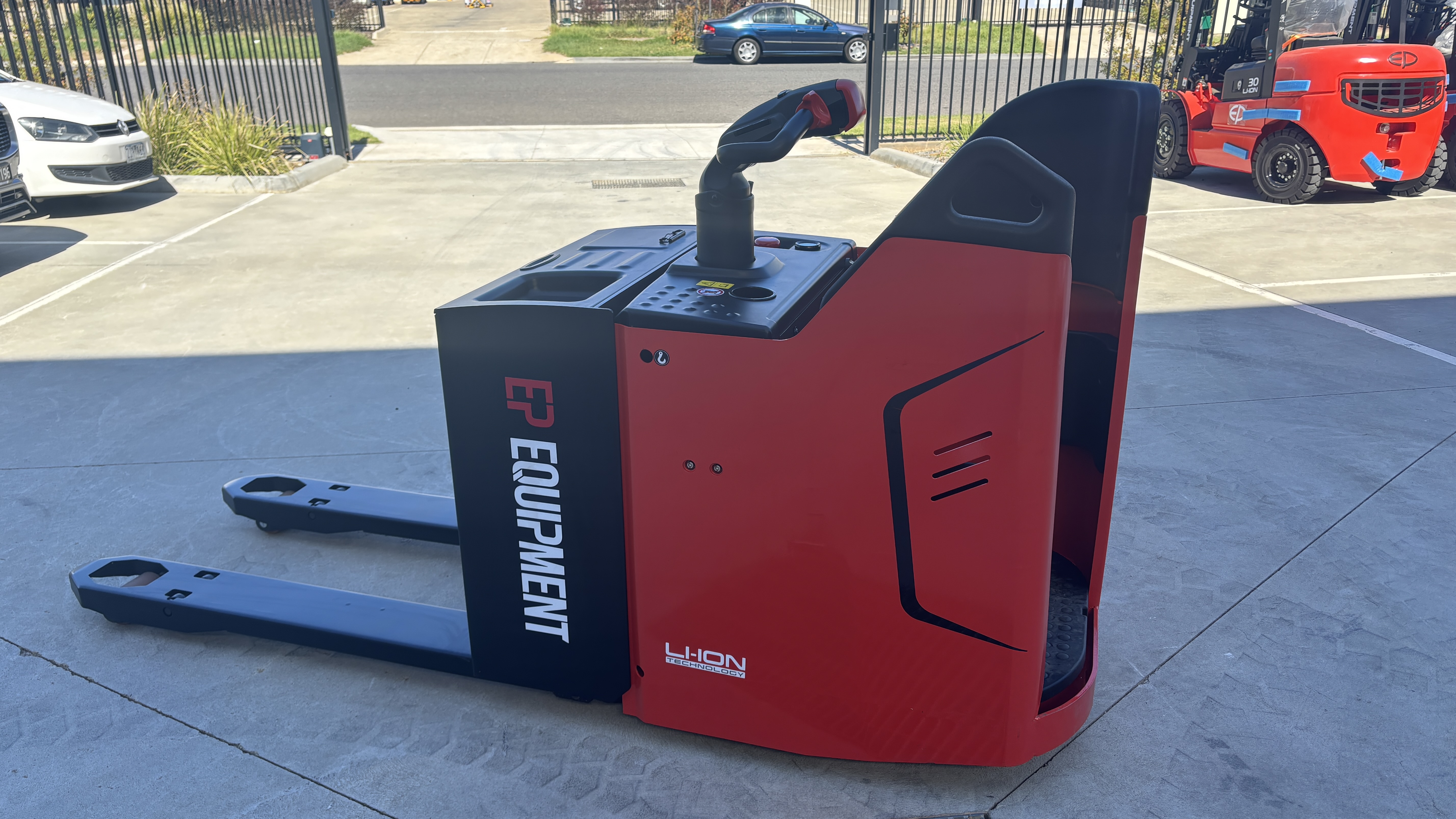Stock photo of KPL201 2.0T lithium electric pallet truck by EP Equipment stop outside warehouse